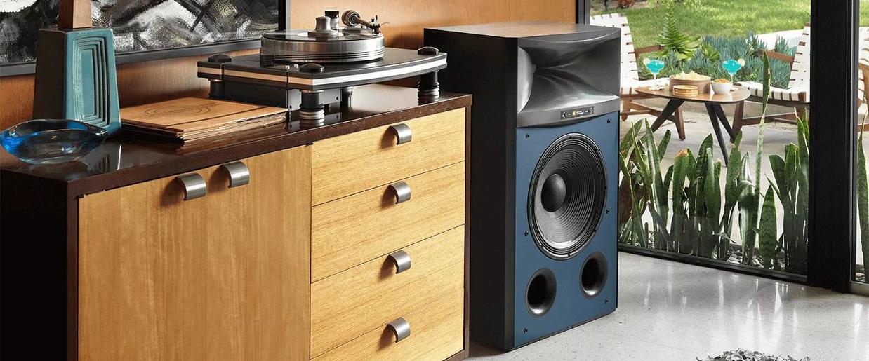 picture of a jbl 4367 speaker in a living room with turntable JBL 4367 speaker placed in living room with a turntable